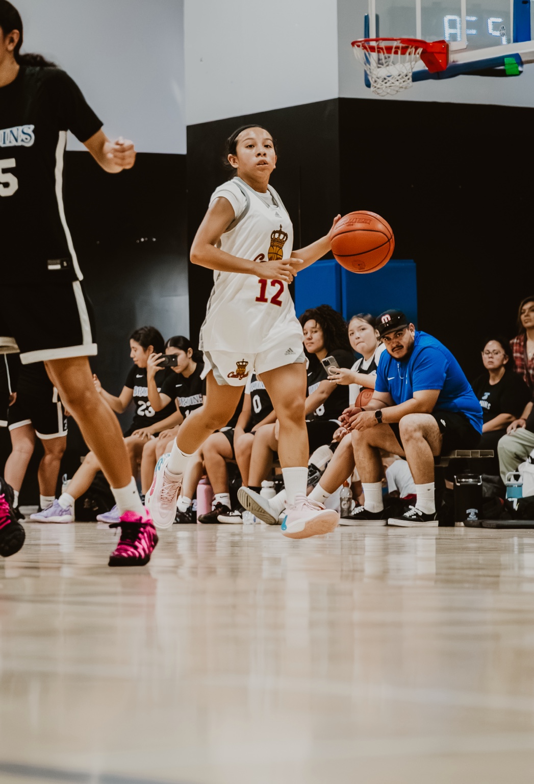 A Cali Gold player driving to the basket during a game